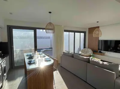 a living room with a couch and a table at 3bd with a private heated pool in Sholan 2 ElGouna in Hurghada