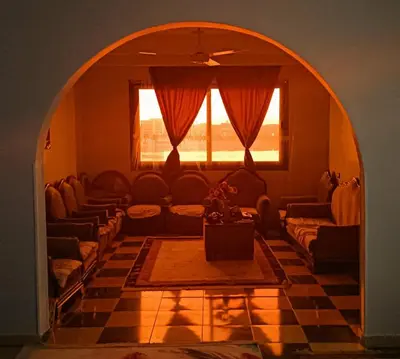 an archway with couches and a table in a living room at Luxor Nile palace in Luxor