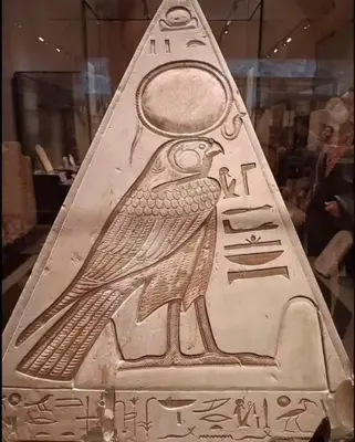 an artifact with a bird on it in a museum at Luxor Nile palace in Luxor