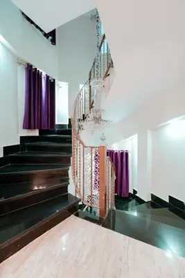 a staircase in a building with purple curtains at Luxury private villa with pool in Hurghada