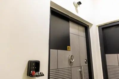 a door in a room with a phone on the wall at F&M Home Egypt - Apartment Hurghada in Hurghada
