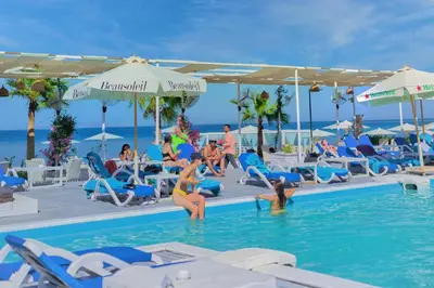 a group of people in the swimming pool at a resort at Selena Bay Luxury Resort - Premium Apartment with Private Beach in Hurghada