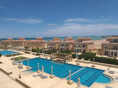 an overhead view of a swimming pool at a resort at Selena Bay Luxury Resort - Premium Apartment with Private Beach in Hurghada