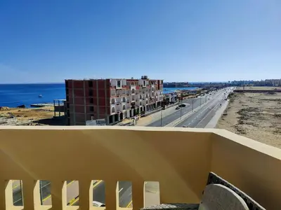 a view of the ocean from the balcony of a building at Sea Dreams @ Hurghada Dreams in Hurghada