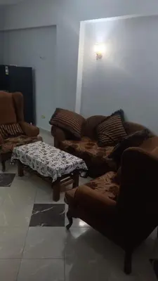 a living room with couches and a coffee table at New ikea flat 2 in Hurghada