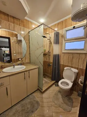 a bathroom with a toilet and a sink and a shower at Hurghada - Apartment Blue Lagoon in Hurghada