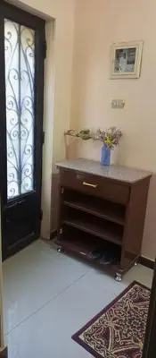a room with a door and a table and a window at NUBA ONe in Aswan