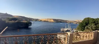 a view of a river with boats in it at Gasser Holiday Home in Aswan