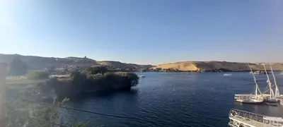 a view of a river with boats in the water at Gasser Holiday Home in Aswan