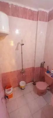 a bathroom with two toilets and a shower at Gasser Holiday Home in Aswan