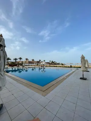 a pool on the roof of a resort at شقة احلامك علي البحر in Hurghada