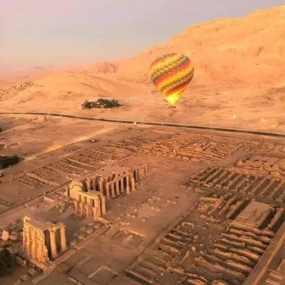 a hot air balloon flying over an ancient city at Cleopatra Nile Cruise From Luxor 3&4 Nights Every Saturday and Monday, Thursday in Luxor