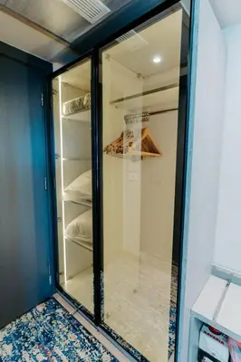 a glass walk in closet in a room at Cleopatra Nile Cruise From Luxor 3&4 Nights Every Saturday and Monday, Thursday in Luxor