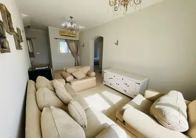 a large living room with a couch and a table at Unique 6 Bedrooms Villa 38 at White Villas El-Gouna in Hurghada