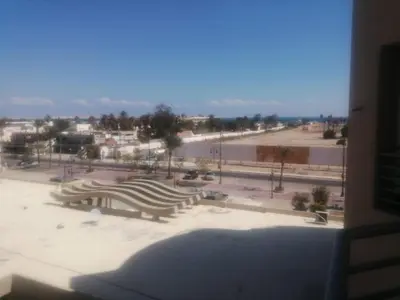 a view from a window of a park with a bench at Princess resort unit number 260A Markos in Hurghada