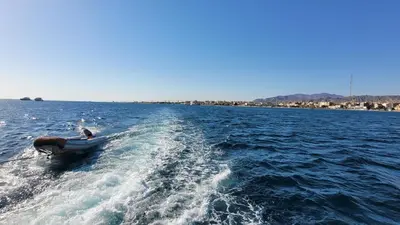a person in a boat in the water at Ahmed House in Safaga