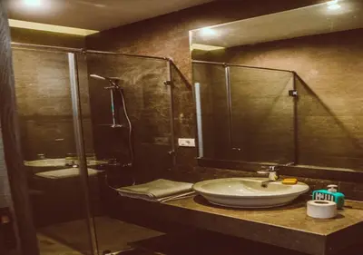 a bathroom with a sink and a glass shower at Peaceful Villa 3BR at Sholan with Private Heated Pool in Hurghada
