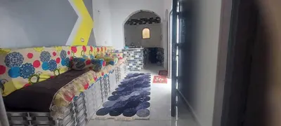 a room with a couch with shoes on it at Abo Tamem Guest House in Aswan