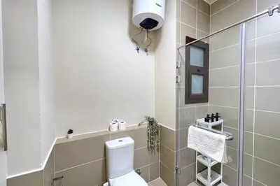 a bathroom with a toilet and a shower at Homelike & Sunny 1 BDR Cyan El Gouna in Hurghada