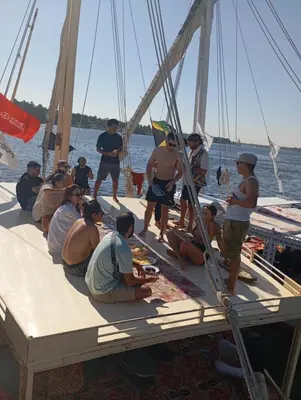 a group of people sitting on a boat at NUBIAN MONALIZA guest house in Aswan