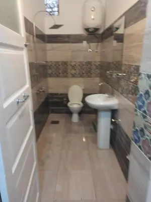 a bathroom with a toilet and a sink at NUBIAN MONALIZA guest house in Aswan