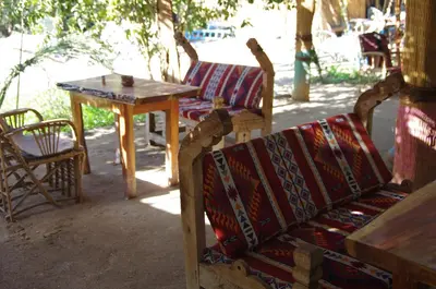 a table and two chairs and a table and a table and chairs at Bedouin Lodge Luxor in Luxor