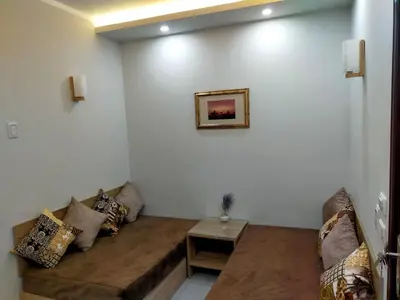 a living room with a couch and a table at Happy Home in Hurghada