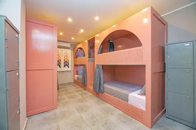 a room with two bunk beds in it at Bedcoin Hostel in Hurghada