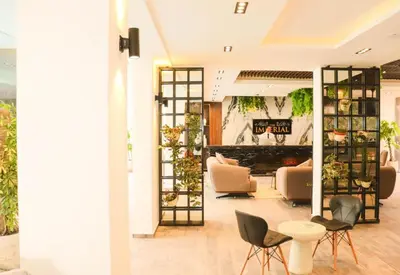 a living room with chairs and a fireplace at Hurghada - Apartment - Sleeps 6 - Pool - Parking in Hurghada