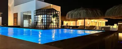 a large swimming pool with blue water at night at Hurghada - Apartment - Sleeps 6 - Pool - Parking in Hurghada