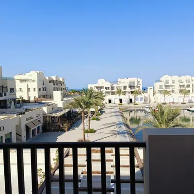 a view from the balcony of a resort at Nayah Stays, Luxurious bedroom in Fanadir Marina in Hurghada