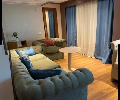 a living room with a couch and a table at Five-star Nile cruise 4 Night from Luxor to Aswan every Monday, Thursday and Saturday in Aswan