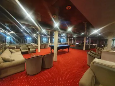 a room with couches and a pool table in it at Five-star Nile cruise 4 Night from Luxor to Aswan every Monday, Thursday and Saturday in Aswan