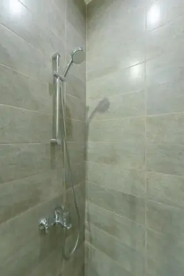 a shower with a shower head in a bathroom at NEW! Gouna, Cyan Cozy 3BR Townhouse Lagoon & Pool in Hurghada