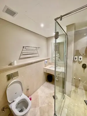 a bathroom with a toilet and a glass shower at Mangrove m3-1b-02 in Hurghada