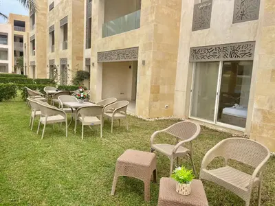 a row of tables and chairs in front of a building at Mangrove m3-1b-02 in Hurghada