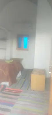 a room with a bed and a yellow box at Nubian King in Aswan