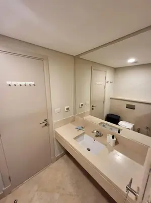 a bathroom with a sink and a large mirror at Mangroovy - 2BR La Blanca Pool View in Hurghada