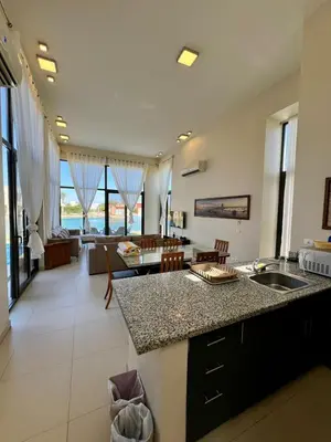 a kitchen and living room with a counter top at tawila t1-17 -5 bed room big villa in Hurghada