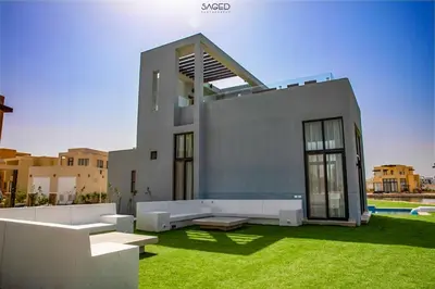 a modern house with a lawn in front of it at tawila t1-17 -5 bed room big villa in Hurghada