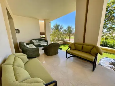 a living room with a couch and chairs and a patio at A S 2108 / 3 bedroom in Hurghada