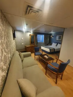 a living room with a couch and a bed at Ultra Nile Cruise 5 Star Luxor To Aswan in Luxor