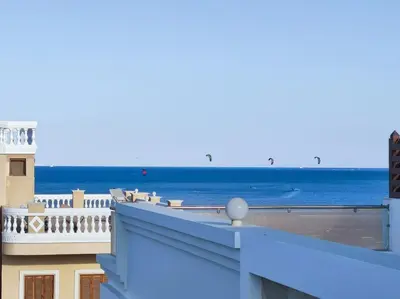 a view of the ocean from the balcony of a building at Boka Bay One in Hurghada
