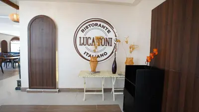 a sign on a wall with a table in a room at Amarina Jannah Resort & Aqua Park Marsa Alam in Coraya Bay