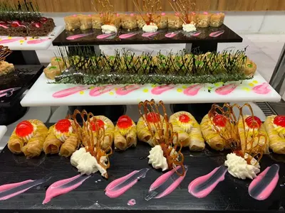 a display of desserts and pastries on a table at Amarina Jannah Resort & Aqua Park Marsa Alam in Coraya Bay