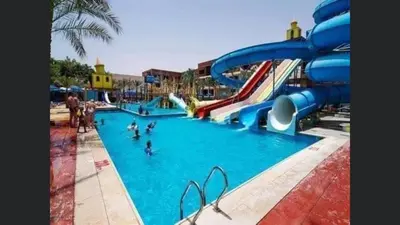 a group of people in a water park at Family Suite in view aqua mirage bay in Hurghada