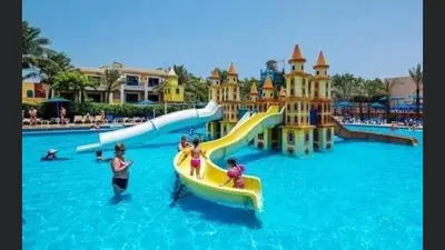 a water park with a slide in the water at Family Suite in view aqua mirage bay in Hurghada