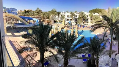 a resort with a pool and a water park at Family Suite in view aqua mirage bay in Hurghada
