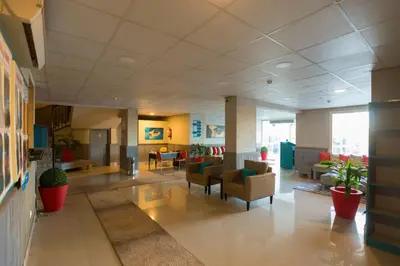 a lobby of a hospital with chairs and tables at Jawhara Inn Hotel - فندق الجوهرة سفاجا in Hurghada