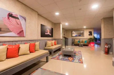 a waiting room with couches and a table at Jawhara Inn Hotel - فندق الجوهرة سفاجا in Hurghada